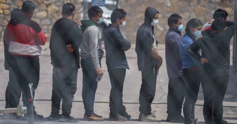 Migrants are seen being processed at the Paso Del Norte International Bridge in El Paso, Texas, on Sept. 1, 2021.