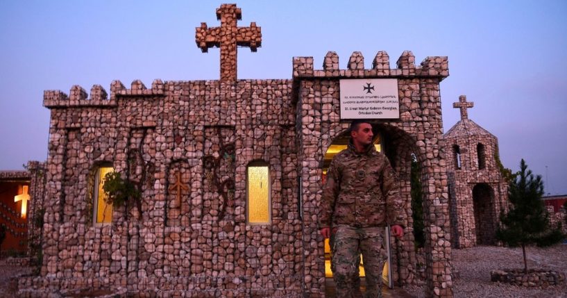 In this photograph taken on Nov. 27, 2019, a Georgian soldier leaves a church after praying at the NATO military base Camp Marmal on the outskirts of Mazar-i-Sharif, Afghanistan.