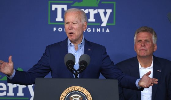 President Joe Biden speaks at a campaign event for Virginia Democratic gubernatorial candidate Terry McAuliffe, right, at the Lubber Run Community Center in Arlington, Virginia, on July 22