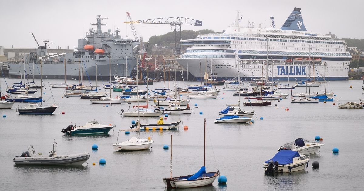 The Tallink cruise ship Silja Europa is seen docked in Falmouth, England, in this file photo from June. Several thousand people will stay aboard the gas-guzzling liner and its sister ship during the upcoming two-week United Nations climate conference in Glasgow, Scotland.