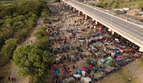 Thousands of migrants camped out under the Del Rio International Bridge in Del Rio, Texas, on Sept. 21.