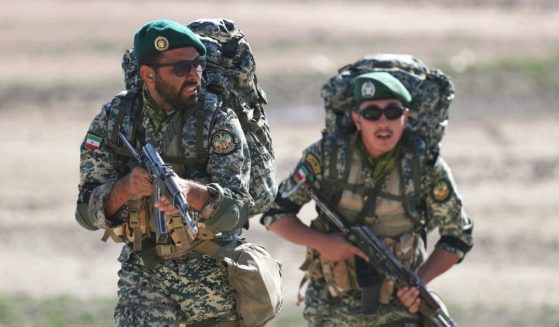 This undated picture released by the official website of the Iranian Army on Friday, Oct. 1, 2021, shows ground forces troops attending a maneuver near Iranian border with Azerbaijan.