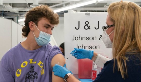 A nurse, Stephanie Wagner, administers the Johnson & Johnson vaccine to Bradley Sharp in New York on July 30.