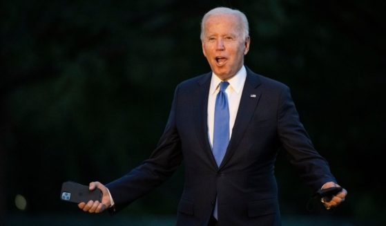 President Joe Biden, seen as he arrived at the White House Friday, has drawn heavy criticism from immigration activists for his administration's attempts to reinstate a Trump-era policy.
