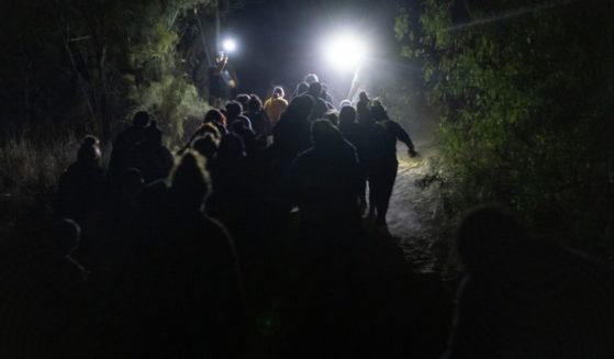 Migrants from Central American are seen near Roma, Texas, after illegally crossing the U.S.-Mexico border early on April 10.