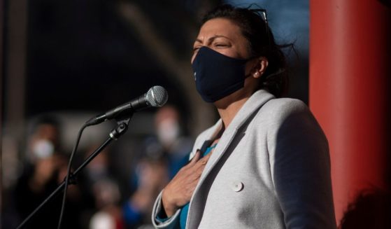 A masked Democratic Rep. Rashida Tlaib speaks during an election rally in Detroit, Michigan, on Nov. 4, 2020.