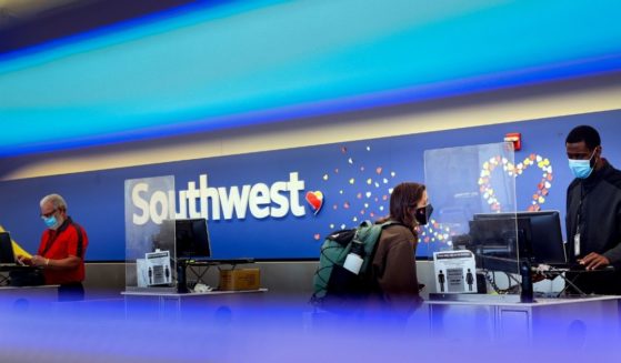 A traveler checks in at the Southwest Airlines ticketing counter at Baltimore Washington International Thurgood Marshall Airport on Oct. 11, in Baltimore, Maryland.