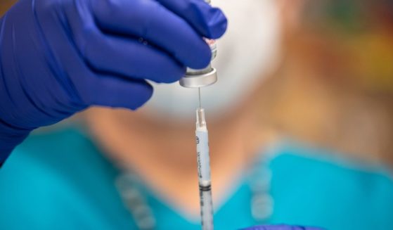 A nurse fills up a syringe with the Moderna COVID-19 vaccine at a senior center in San Antonio on March 29.