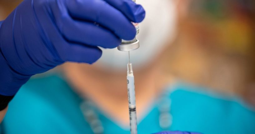 A nurse fills up a syringe with the Moderna COVID-19 vaccine at a senior center in San Antonio on March 29.