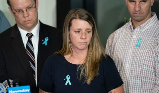 Nichole Schmidt, mother of Gabby Petito, whose death on a cross-country trip has sparked a manhunt for her boyfriend, Brian Laundrie, pauses as she answer reporters' questions during a news conference on Sept. 28, 2021.