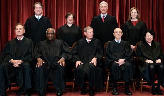 Members of the Supreme Court pose for a group photo in Washington, D.C., on April 23.