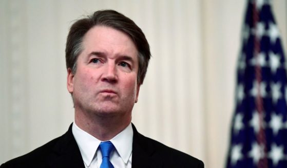 Supreme Court Justice Brett Kavanaugh waits in the East Room of the White House before a ceremonial swearing in Oct. 2018.