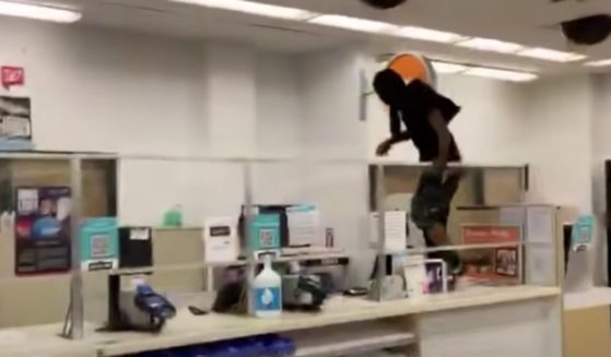 A shoplifter jumps over the counter in a San Francisco Walgreens during the height of the pandemic last October.