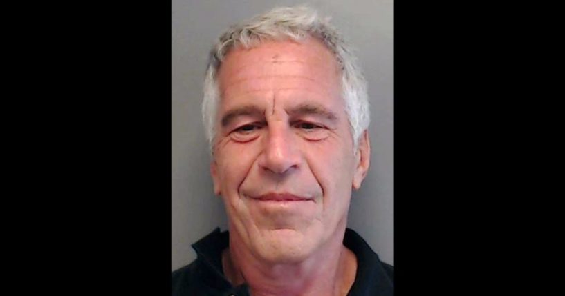 In this handout provided by the Florida Department of Law Enforcement, Jeffrey Epstein poses for a sex offender mugshot after being charged with procuring a minor for prostitution on July 25, 2013, in Florida.