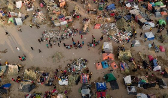 Migrants, many from Haiti, are seen at an encampment along the Del Rio International Bridge near the Rio Grande in Del Rio, Texas, on Sept. 21, 2021.