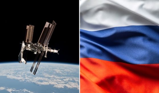 The International Space Station and the docked space shuttle Endeavour orbit Earth on May 23, 2011. The Russian flag is seen in the stock image on right.