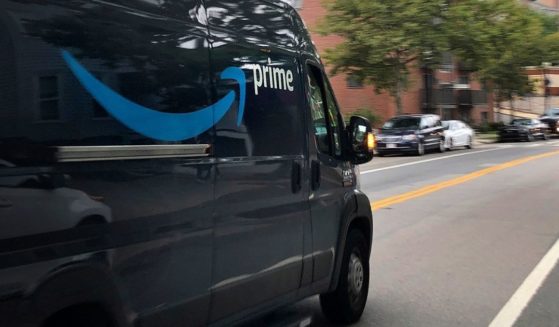 An Amazon delivery truck moves through a neighborhood in Boston, Massachusetts, on Oct. 2, 2020.