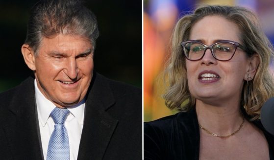 Sen. Joe Manchin, left, arrives at a ceremony on the South Lawn of the White House in Washington, D.C., on Nov. 15. Sen. Kyrsten Sinema speaks during a ceremony on the South Lawn of the White House in Washington, D.C., on Nov. 15.