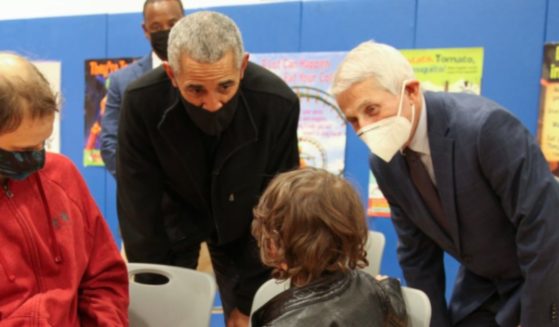 Former President Barack Obama, middle, and Dr. Anthony Fauci, right, visited Kimball Elementary School in Washington, D.C., on Tuesday to encourage young children to get the COVID-19 vaccination.