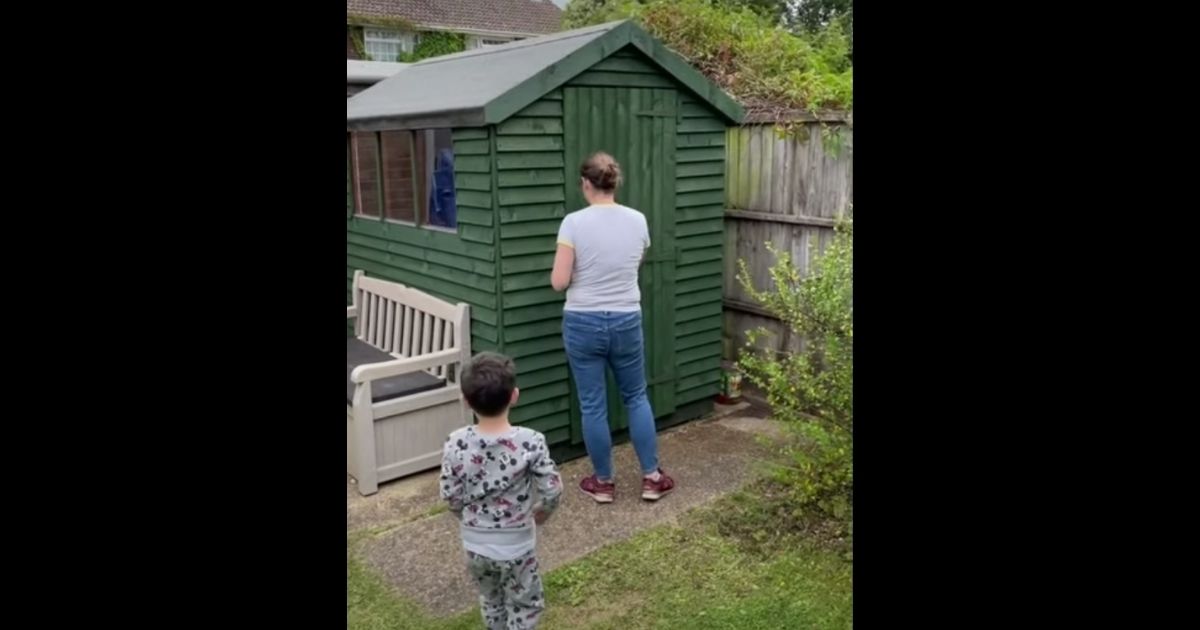 Cheryl Binmore prepares to step inside the shed her husband renovated in her backyard in Chandler's Ford, Hampshire.