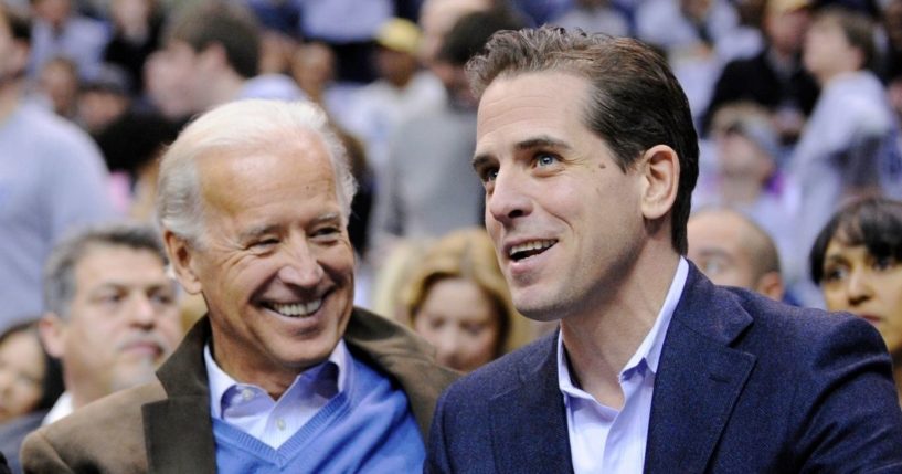 Then-Vice President Joe Biden, left, and his son Hunter Biden, right, attend the Duke vs. Georgetown NCAA college basketball game in Washington, D.C., on Jan. 30, 2010.