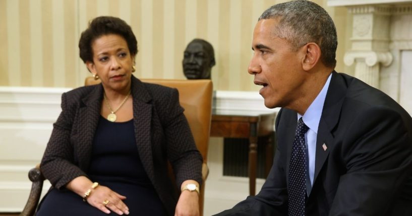 Then-President Barack Obama and his attorney general, Loretta Lynch, talk to reporters in the Oval Office of the White House in Washington on May 29, 2015.