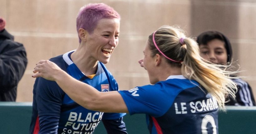 Megan Rapinoe, left, celebrates with OL Reign teammate Eugénie Le Sommer during a game against the Washington Spirit at Cheney Stadium in Tacoma, Washington, on Nov. 14.