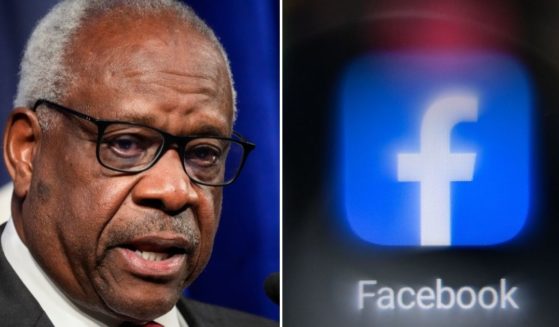 Supreme Court Justice Clarence Thomas speaks at The Heritage Foundation on Oct. 21, 2021, in Washington, D.C. The Facebook logo is seen on a cellphone screen in Moscow on Nov. 19, 2021.