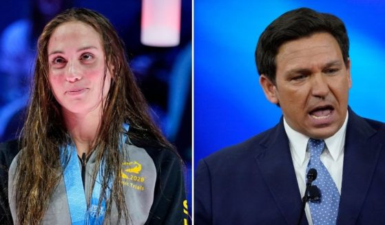 Republican Gov. Ron DeSantis of Florida, right, recognized NCAA swimmer Emma Weynant, left, as the best women's 500-yard freestyle swimmer after she came in second place to transgender swimmer Lia Thomas.