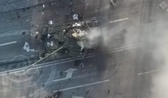 Drone footage shows the tank taking repeated hits as the crew attempted to scramble out of it.