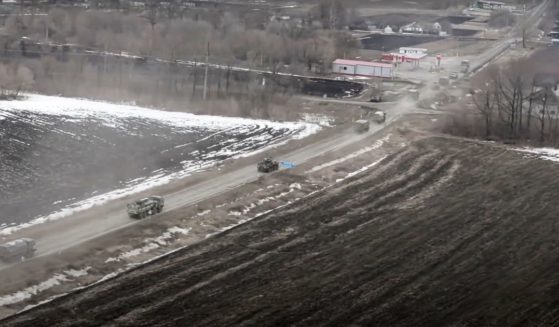 A Russian military helicopter took aerial footage of Russian military vehicles moving through an undisclosed location in Ukraine on March 3.