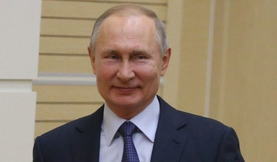 Russian President Vladimir Putin grins in a 2020 file photo.