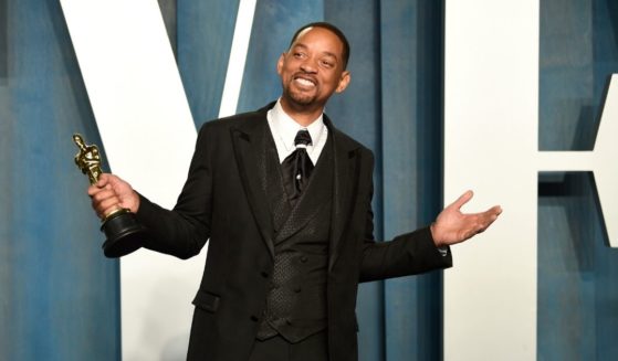 Will Smith posed with his Oscar at the Vanity Fair Oscar Party on Sunday night.