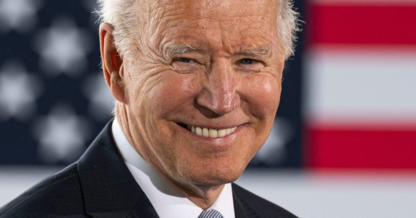 President Joe Biden smiles during a speech at the Portland Air National Guard base in Oregon on Thursday.