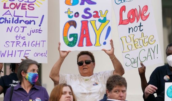 Protestors hold signs on the steps of the Florida Historic Capitol Museum in front of the Florida State Capitol to protest Gov. Ron DeSantis' Parental Rights in Education bill and advocate for LGBTQ+ students. However, a recent CDC study has determined that high school students who identify as LGBTQ+ are afflicted with higher depression rates.