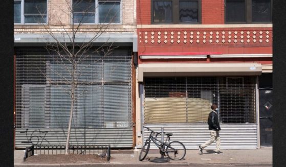 Vacant New York City storefronts are seen in a file photo from April 2021. A large multinational bank is predicting a major recession for the US.