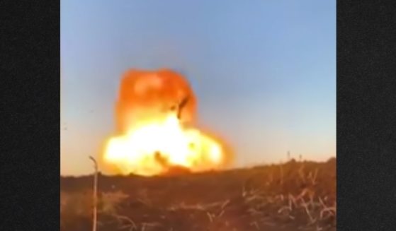 A video shared online shows a Russian tank - stationary and likely abandoned - being blown up.