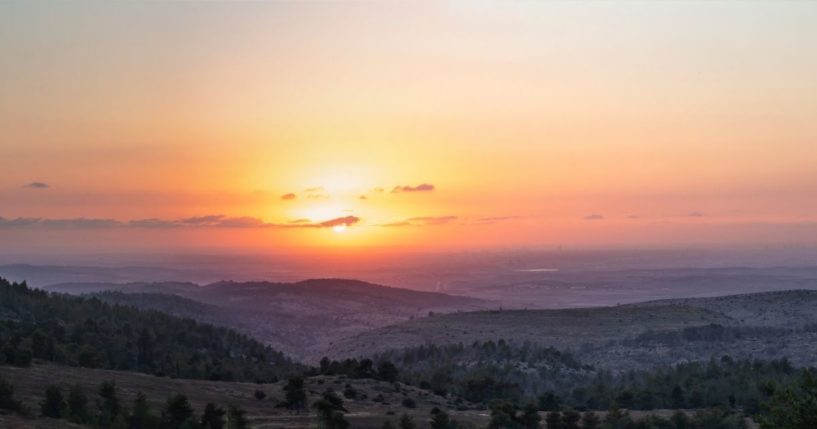 The sun rises in this stock image.