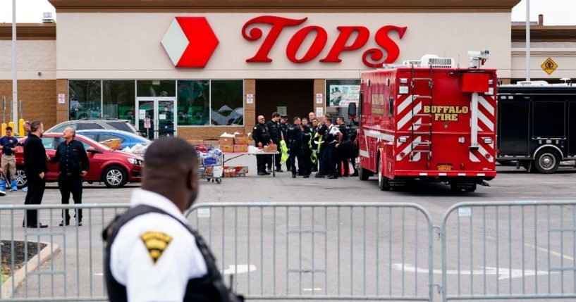 Investigators work the scene of a shooting at a supermarket in Buffalo, New York, on Monday.