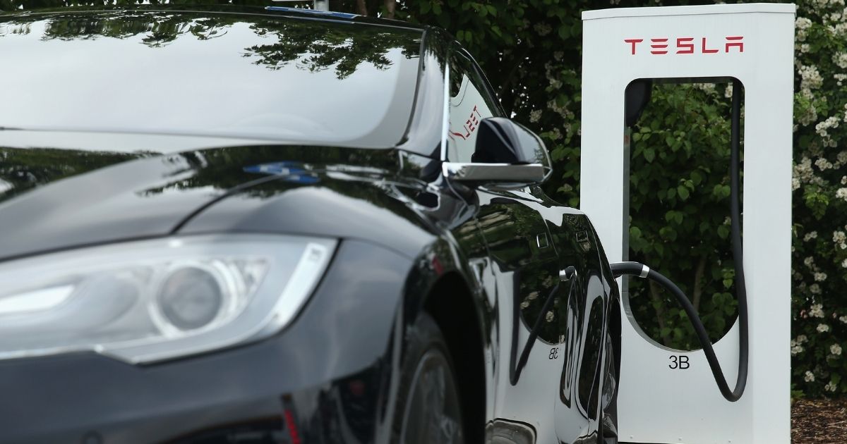 A Tesla electric-powered sedan is pictured at a charging station in Germany in 2015.