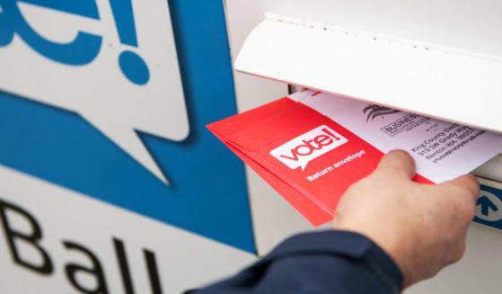 A stock photo shows ballots being placed into a drop box in Washington state on March 10, 2020.