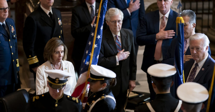 Democratic Speaker of the House Nancy Pelosi, Republican Senate Minority Leader Mitch McConnell and Republican House Minority Leader Kevin McCarthy attend a Congressional Gold Medal ceremony to honor members of the Merchant Marine who served in World War II, at the Capitol in Washington, D. C., on Wednesday.