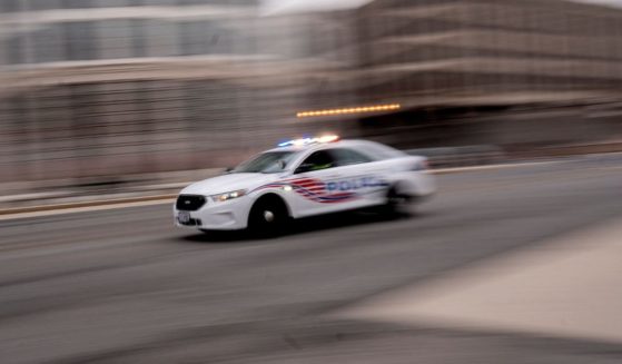 A police car is pictured driving through Washington, D.C., on Jan. 25.