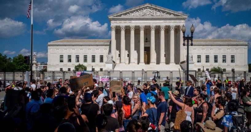 Pro- and anti-abortion demonstrators gather in front of the Supreme Court on Saturday in Washington, D.C.