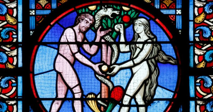 A stained glass portrayal of Adam and Eve is seen in the above stock image.