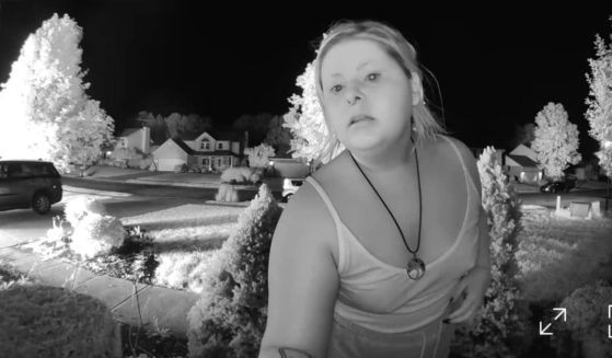 A doorbell camera shows the woman who spotted the fire from nearly a mile away and drove to the house to alert the sleeping family.