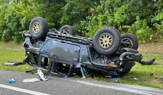 A Jeep is seen flipped at State Road 100 and John Anderson Blvd. in Flagler County, Florida.