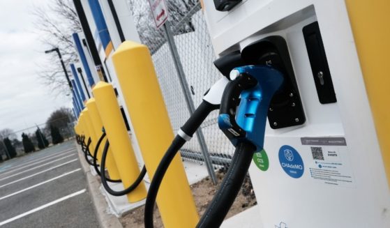 A row of fast-charging stations for electric vehicles is pictured near New York's John F. Kennedy airport in April 2021.