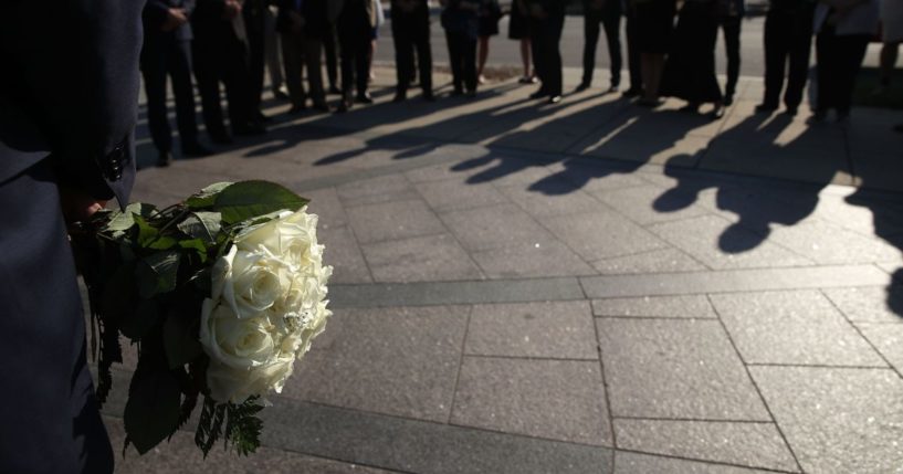 People attend a remembrance event at the Victims of Communism Memorial on Aug. 23, 2017, in Washington, D.C.