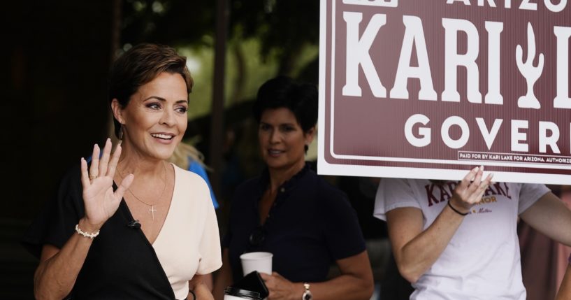 Kari Lake, Republican candidate for Arizona governor, waves to supporters before speaking at a news conference this week in Phoenix.